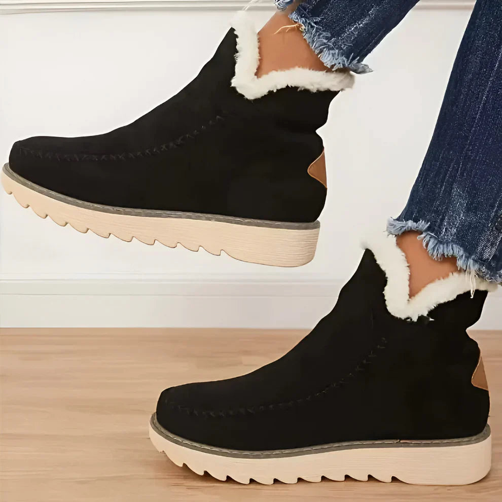 Kuschelige, mit lammfell gefütterte stiefeletten für damen