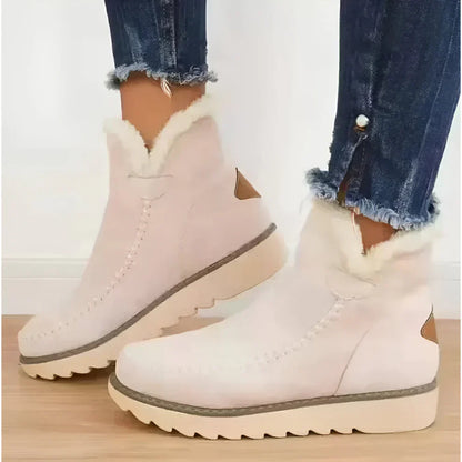 Kuschelige, mit lammfell gefütterte stiefeletten für damen